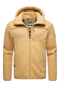 Chaqueta de forro polar amarilla con un diseño de doble capa, bolsillo en el pecho con cremallera y bolsillos laterales. Cuenta con capucha y textura suave.