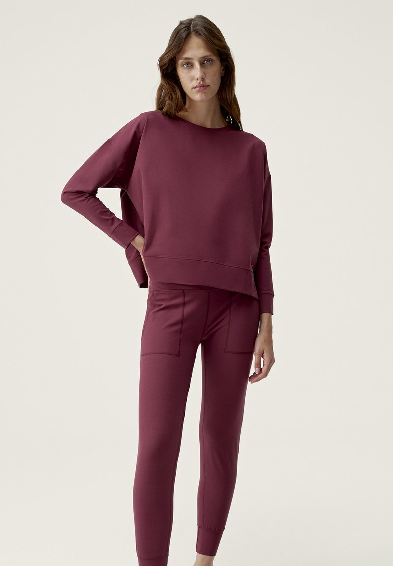 Born Living Yoga Trainingsbroek bordeauxrood