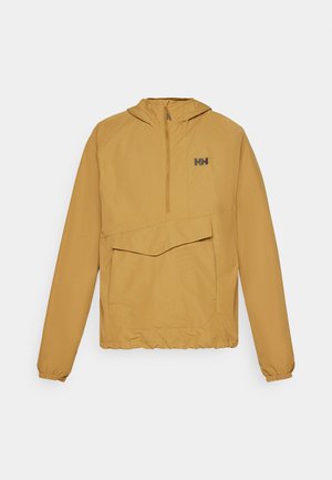 Leichte gelbe Jacke mit einem halben Reißverschluss, großer Fronttasche, verstellbarem Kapuzen und elastischen Bündchen. Hergestellt aus glattem, wasserdichtem Material.