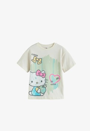 Light-colored cotton t-shirt featuring a graphic of a cat with a bow, splashes of green paint, and text: "Love," "so cute," and "HK."