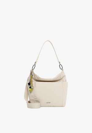 Beige shoulder bag with wide strap, front pocket, and colorful decorative charms hanging from one side.