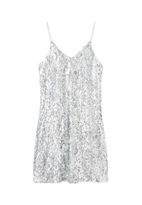 Camisola di paillettes argento con spalline sottili, caratterizzata da un scollo a V e una vestibilità morbida. Texture scintillante data da numerosi paillettes riflettenti.