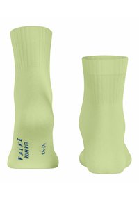 Jasnozielone skarpetki z prążkowanym wzorem, z niebieskim napisem "FALKE RUNRIB" oraz rozmiarem 42-43 z boku. Miękka, gładka tekstura.