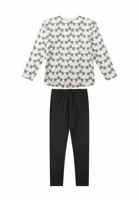 Weißes langärmliges Shirt mit schwarzem Sternmuster, kombiniert mit schwarzen Leggings. Beide Teile bestehen aus weichem, flexiblem Stoff für Komfort.