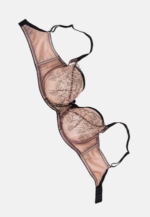 Underwire bra in nude with black floral embroidery. Adjustable straps, sheer lace details, and hook-and-eye back closure. Smooth material.