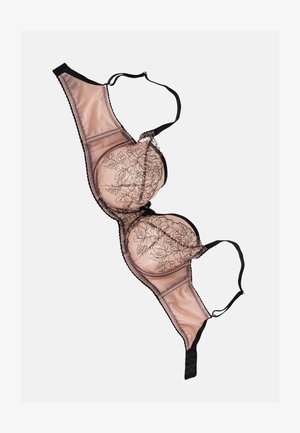 Underwire bh i nude med sort blomsterbroderi. Justerbare stropper, gennemsigtige blonde detaljer og hægte-lukning bagpå. Glat materiale.
