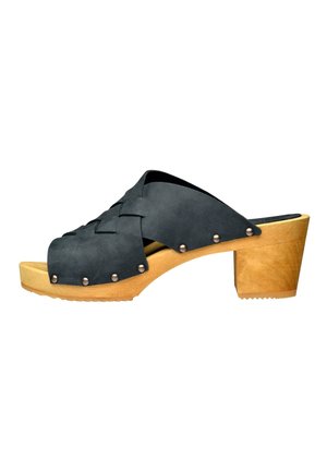 Black leather wedge sandals with a woven upper, wooden heel, and metallic studs along the sides. Textured outsole for grip.