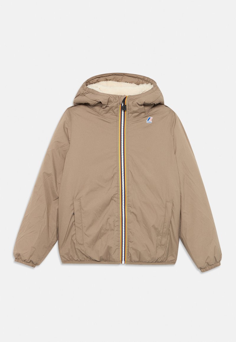 Beige Kapuzenjacke mit Reißverschluss und gefüttertem Innenfutter, elastischen Bündchen und einem mehrfarbigen Reißverschluss. Logopatch auf der Brust.