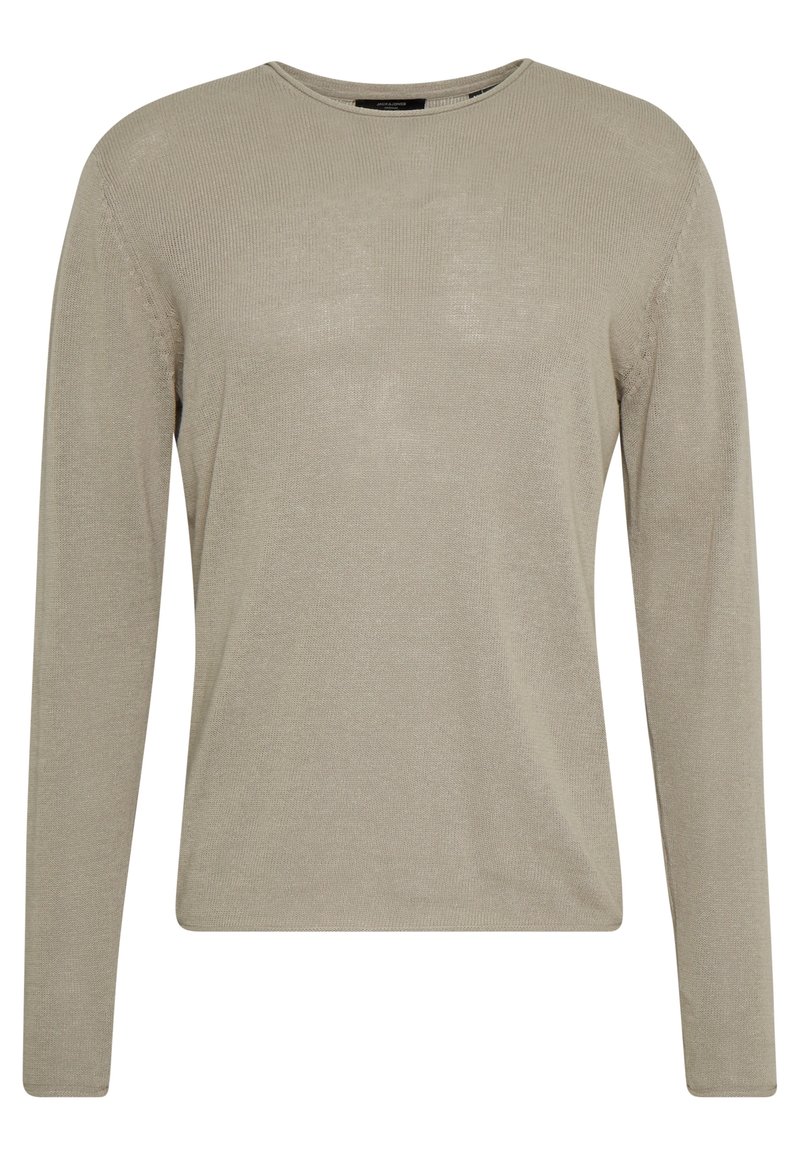 Beige långärmad ribbstickad tröja med rund halsringning, med en mjuk textur och minimalisk design. Inga synliga mönster eller detaljer.