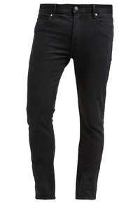 Jean noir slim avec boutons et fermeture éclair à l'avant, poches latérales et passants pour ceinture, présenté sur un fond blanc.