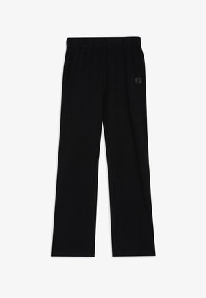 Pantalon noir à jambes droites avec taille élastique et petit patch logo sur la partie supérieure de la cuisse droite, présenté sur fond blanc.