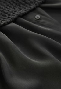 Next Striktrøje - black