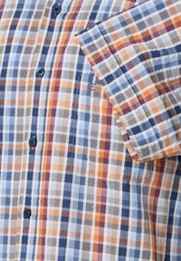 Short-sleeve plaid shirt in blue, orange, and beige. Features a chest pocket, button-down front, and contrasting buttons. Cotton fabric.