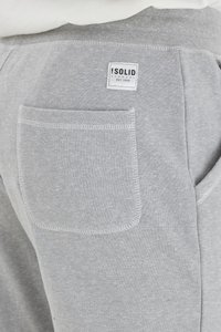 Gray sweatpants made of cotton blend, featuring a back pocket with contrasting stitching and a brand label at the waistband.