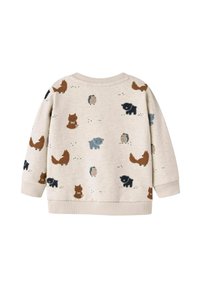 Gai beidzas džemperis ar mīkstu tekstūru, uz kura ir atkārtoti zīmējumi ar dzīvniekiem dažādās krāsās: brūni lapsas, zilie ezīši un melni zīmējumi.