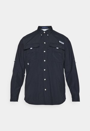Dark blue long-sleeve shirt with a button-up front, two chest pockets, and roll-up sleeves. Made from lightweight fabric, featuring a subtle texture.