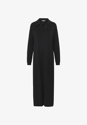 Zwarte lange mouw jurk van gebreid materiaal, met een kraaghalslijn en een rechte, losse pasvorm die tot halverwege het been valt.