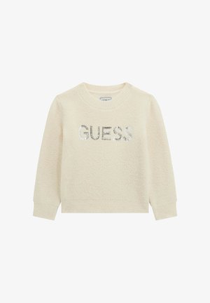 Pull à manches longues couleur crème avec poignets et ourlet côtelés, avec le mot "GUESS" en sequins argentés sur la poitrine.
