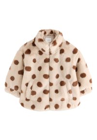 Veste en fausse fourrure crème à pois marron, avec col, fermeture éclair devant et poches latérales, présentant une finition douce et texturée.