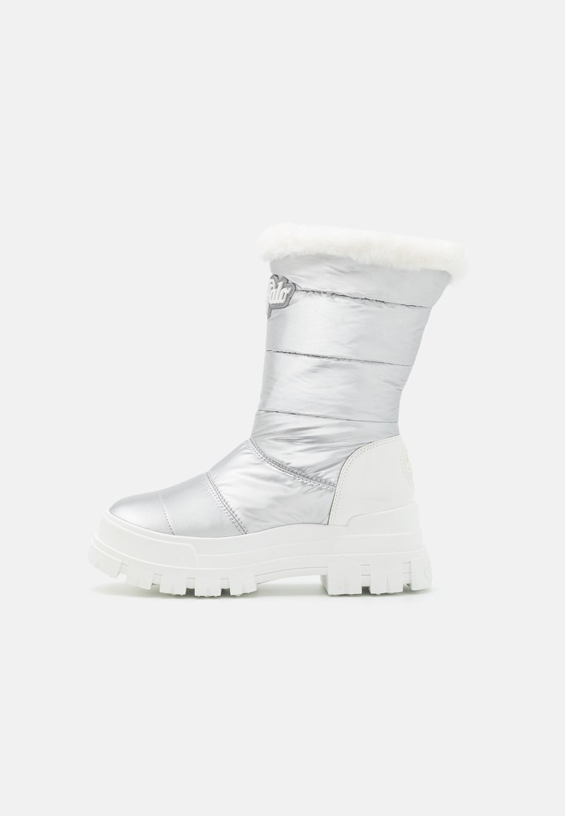 Silver quilted winter boot with a white faux fur cuff and chunky white sole. Features a logo accent on the side.