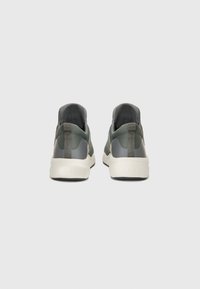 Sleek athletic shoes featuring a dark green mesh upper with gray accents, rubber soles, and a pull tab at the heel for easy wear.