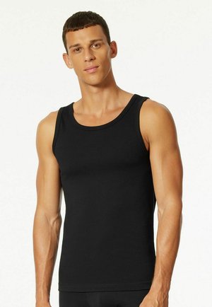 Black tank top made of stretchy, smooth fabric. It features a classic cut with wide shoulder straps and a round neckline.