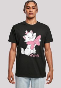 Juoda marškinėliai su baltu animaciniu katinu su rožiniu kaspinu, žemiau užrašas "Marie", trumpomis rankovėmis, standartinio dydžio, minkšta audinio tekstūra.