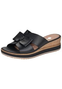 Sandali wedge neri in pelle con due grandi fiocchi sulla fascia, design open-toe e una soletta in sughero texture con una linea di accento bianca.