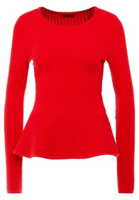Rotes Longsleeve-Oberteil mit Peplum-Form, strukturiertem Strickstoff und rundem Halsausschnitt. Mit gerippten Details über das gesamte Kleidungsstück.
