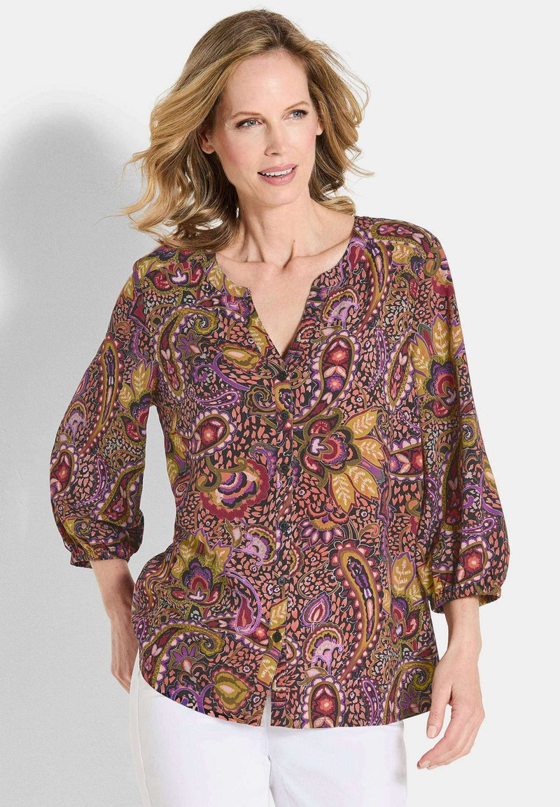 Multicolor knoopshirt met een paisleypatroon, met lange mouwen en een ronde hals. Gemaakt van lichte stof.