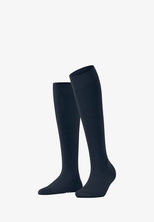 Chaussettes de compression montantes en bleu marine uni, fabriquées à partir d'un tissu lisse et extensible avec des poignets renforcés et un design épuré.