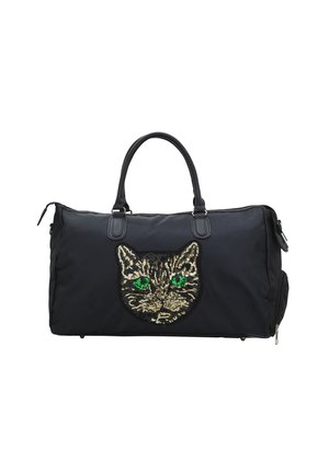 Borsa duffle nera con un grande design a faccia di gatto in paillettes con occhi verdi. Realizzata in nylon, con manici resistenti e chiusura con zip.