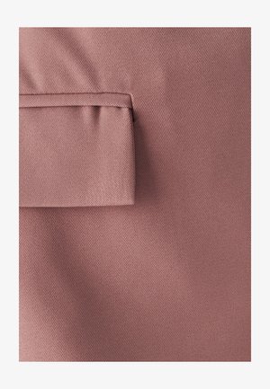 Textured fabric in soft rose color with a prominent folded pocket detail. The surface features a subtle diagonal weave pattern.