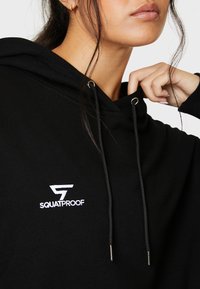 SQUATPROOF SP LEFT COMFY ACTIVE PUMP COVER  - Jersey con capucha - black