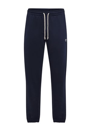 Mørkeblå joggingbukser med elastisk talje og ankelsømme, hvid snor, sidelommer og lille logo på venstre lår.