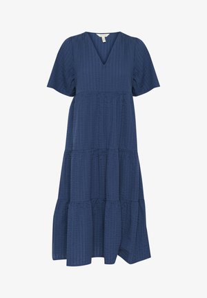 Marinblå kjole med V-hals, korte pufærmer, tiered design og tekstureret stof med et subtilt mønster. Udsvinget kant.