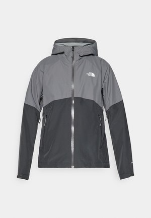 Vandeniui atspari striukė pilkos ir juodos spalvos, su užtrauktuku priekyje, reguliuojama kapišonu ir dviem šoninėmis kišenėmis. Logotipas krūtinėje.