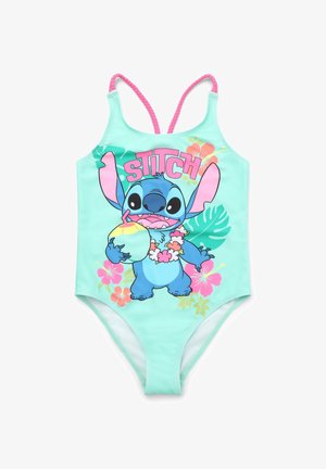 Costume intero verde menta con spalline rosa, decorato con un personaggio dei cartoni che tiene una noce di cocco e dettagli floreali in rosa e verde.