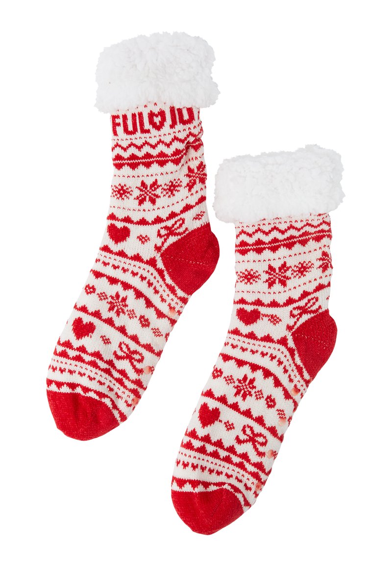 Czerwono-białe skarpetki na drutach z puszystym białym mankietem. Z wzorami świątecznymi, w tym sercami i płatkami śniegu, ze wzmocnionym piętą i palcami.