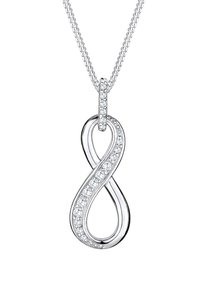 Colgante en forma de infinito de plata con piedras preciosas transparentes redondas incrustadas a lo largo de un lado, colgando de una cadena fina. Acabado brillante con textura suave.