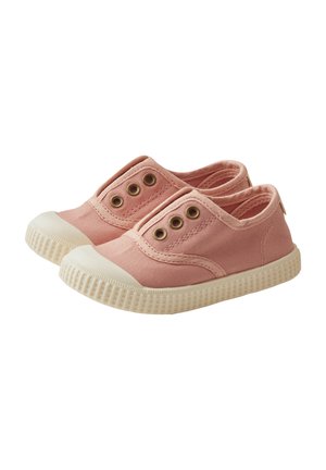 Pink canvas slip-on shoes with three metal eyelets, white rubber toe cap, and textured white sole. Simple design with functional accents.