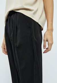 Desires ARVIN MID WAIST WIDE LONG - Hlače - black