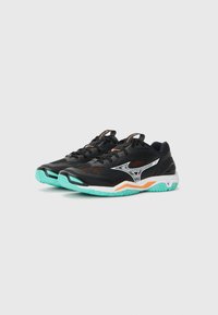 Black athletic shoes with mesh upper, orange accents, and curved white logo. Features a turquoise sole and textured tread for grip.