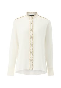 White long-sleeve blouse featuring a mandarin collar, decorative gold stitching, and round buttons along the front. Smooth, lightweight fabric.