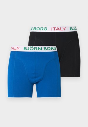 Dos pares de calzoncillos bóxer de hombre, uno azul y uno negro, cada uno con cinturillas blancas con "BJÖRN BORG" en verde y "ITALY" en rojo.