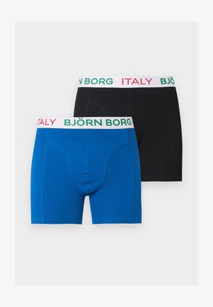 Dos pares de calzoncillos bóxer de hombre, uno azul y uno negro, cada uno con cinturillas blancas con "BJÖRN BORG" en verde y "ITALY" en rojo.