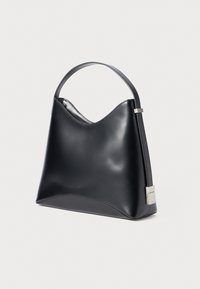 Black leather shoulder bag with a curved design, smooth texture, and a sleek silver hardware accent on the strap.