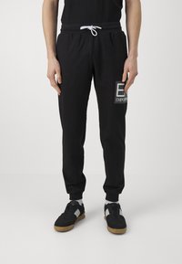 EA7 Emporio Armani - TROUSER - Tracksuit bottoms - nero Thumbnail Image 1