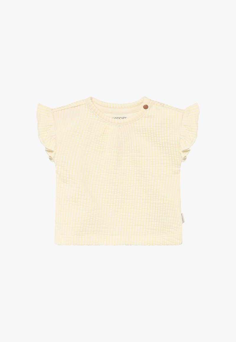 Haut jaune clair à manches courtes avec motif à carreaux texturé, accents de manches volantées et une fermeture à un bouton près du col.