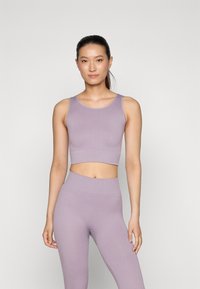 Light lavender ribbed crop top and high-waisted leggings, featuring a smooth, stretchy texture and seamless design for a fitted look.